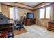 Home office with wood desk and chair, and built-in shelving at 11052 Zephyr St, Broomfield, CO 80021