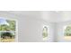 Bright bedroom featuring three windows providing abundant natural light and scenic outdoor views at 13465 Valentia Pl, Thornton, CO 80602