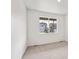 Bedroom with carpet, base-molding and a large window for natural light at 13465 Valentia Pl, Thornton, CO 80602