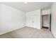 Bedroom with carpet, a closet with double doors and an entrance to another room at 13465 Valentia Pl, Thornton, CO 80602