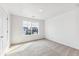 Comfortable bedroom with neutral carpet, a window, and a closet door at 13465 Valentia Pl, Thornton, CO 80602