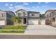 Beautiful two-story home with a three car garage, stone accents and landscaped front yard at 13465 Valentia Pl, Thornton, CO 80602