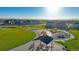 Aerial view of neighborhood park featuring playground, picnic area, and walking paths at 13465 Valentia Pl, Thornton, CO 80602