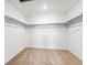 Walk-in closet with carpet and shelving at 13465 Valentia Pl, Thornton, CO 80602