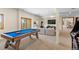 Game room featuring a pool table, large screen TV, and comfortable seating at 13326 Kuehster Rd, Littleton, CO 80127