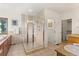 Bathroom with walk-in shower, soaking tub, and double vanity at 13326 Kuehster Rd, Littleton, CO 80127
