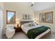 Bright bedroom with modern decor, wood-framed windows, and carpet flooring at 13326 Kuehster Rd, Littleton, CO 80127