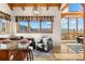 Charming breakfast nook with large window overlooking mountain views and stylish lighting at 13326 Kuehster Rd, Littleton, CO 80127