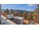 Deck overlooking mountain views, complete with fire pit and seating at 13326 Kuehster Rd, Littleton, CO 80127