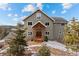 Two-story home with wood accents & mountain backdrop at 13326 Kuehster Rd, Littleton, CO 80127