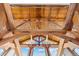 High ceilings with exposed wooden beams and large windows offering scenic views at 13326 Kuehster Rd, Littleton, CO 80127