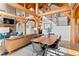 Spacious dining and living areas with open floor plan and timber frame architecture at 13326 Kuehster Rd, Littleton, CO 80127