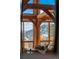 Living area showcasing a comfortable couch and stunning mountain views through expansive windows at 13326 Kuehster Rd, Littleton, CO 80127