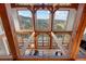Open-concept living space features high ceilings, exposed beams, and scenic mountain views through large windows at 13326 Kuehster Rd, Littleton, CO 80127