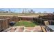 Landscaped backyard with stone patio, grassy area, and privacy fence, offering a peaceful outdoor space at 7840 Ogden Ct, Denver, CO 80229