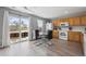 Eat-in kitchen with a glass dining table and a door leading to the backyard at 7840 Ogden Ct, Denver, CO 80229
