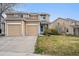 Two-story home featuring an attached two-car garage, well-kept lawn and inviting curb appeal at 7840 Ogden Ct, Denver, CO 80229
