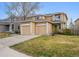 Inviting two-story home featuring a two-car garage and well-maintained front yard at 7840 Ogden Ct, Denver, CO 80229