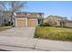 Charming home with a two-car garage, neat lawn and concrete driveway at 7840 Ogden Ct, Denver, CO 80229