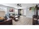 Comfortable living room featuring stylish furniture, decor, and hardwood flooring at 7840 Ogden Ct, Denver, CO 80229