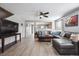 Stylish living room featuring a large sectional, modern decor, and hardwood floors at 7840 Ogden Ct, Denver, CO 80229