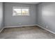 Bedroom featuring neutral walls, carpet, and window with views of the neighborhood at 3354 S Flower St # 52, Lakewood, CO 80227