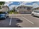 Apartment building with parking spaces and lush green landscaping, situated in a well-maintained community at 3354 S Flower St # 52, Lakewood, CO 80227