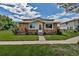 Charming home featuring a stone facade, well-maintained lawn and easy access to the front door at 3354 S Flower St # 52, Lakewood, CO 80227