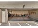 Spacious one-car garage provides ample storage, featuring built-in shelving and a clutter-free environment at 3354 S Flower St # 52, Lakewood, CO 80227