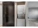 Efficient laundry closet with stacked washer and dryer set, conveniently located near other rooms at 3354 S Flower St # 52, Lakewood, CO 80227