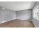 Spacious living room with hardwood floors and large window letting in natural light at 3354 S Flower St # 52, Lakewood, CO 80227