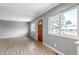 Bright living room with wood-look floors, large windows, and freshly painted walls offering a modern look at 3354 S Flower St # 52, Lakewood, CO 80227