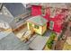 Aerial view of a home's back yard featuring a wooden deck, small patio area, and unique detached structure at 3424 N Marion St, Denver, CO 80205