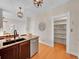 Bright and open kitchen featuring granite countertops, stainless appliances, and easy access to pantry at 3424 N Marion St, Denver, CO 80205