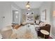 Comfortable living room featuring hardwood floors, modern furniture, and a bright window at 3424 N Marion St, Denver, CO 80205