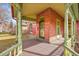 Inviting covered porch with painted wood floors and brick siding at 3424 at 3424 N Marion St, Denver, CO 80205