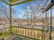 Inviting porch view with yellow railings and a neighborhood view at 3424 N Marion St, Denver, CO 80205