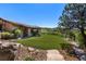 Backyard with artificial turf, stone pathway, and mountain views at 15175 W Belleview Ave, Morrison, CO 80465