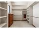 Walk-in closet with custom shelving and storage solutions at 15175 W Belleview Ave, Morrison, CO 80465