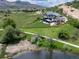 Stunning multi-story home featuring a manicured lawn and scenic views at 15175 W Belleview Ave, Morrison, CO 80465