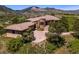 Stunning stone home with mature landscaping, circular driveway, and panoramic mountain views at 15175 W Belleview Ave, Morrison, CO 80465