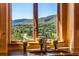 A kitchen view showcasing mountain views through a window at 15175 W Belleview Ave, Morrison, CO 80465
