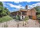 Backyard featuring a covered patio area and low-maintenance landscaping at 3306 S Uinta Ct, Denver, CO 80231