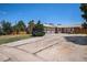 A charming brick home with a spacious driveway and a well-manicured lawn and a two car garage at 3306 S Uinta Ct, Denver, CO 80231
