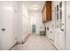 Laundry room features a utility sink, ample storage, and access to the backyard at 3306 S Uinta Ct, Denver, CO 80231