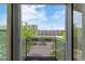 Balcony view overlooking city buildings and blue sky, offering an urban living experience at 2680 Blake St # 4, Denver, CO 80205
