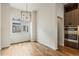 Dining area with ample natural light, modern lighting fixture, and sleek built-in appliances at 2680 Blake St # 4, Denver, CO 80205