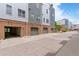 Modern townhome exteriors with brick accents, garage parking, and well-maintained landscaping, blending style and functionality at 2680 Blake St # 4, Denver, CO 80205