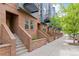 Charming townhome with brick facade, inviting entryways, and well-kept sidewalks for a welcoming street presence at 2680 Blake St # 4, Denver, CO 80205