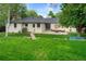 Spacious backyard features a large lawn and patio with comfortable outdoor seating at 801 S Harrison St, Denver, CO 80209